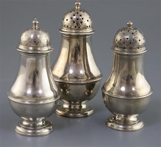 A suite of three early George II Scottish silver baluster pepperettes by James Mitchelson I, gross weight 21 oz.